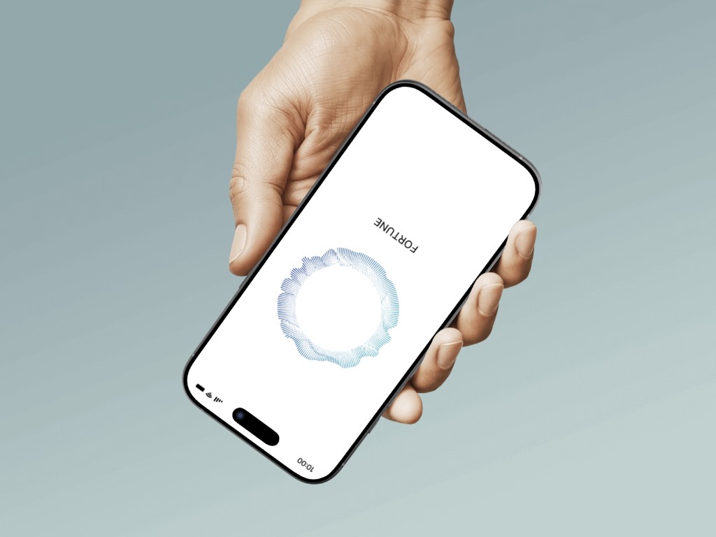 Fortune app – hand holding iPhone showing AI voice interface